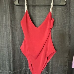 Stylish Maroon One Piece body suit w/ rhinestones strap's.